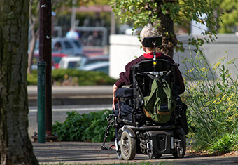 young person on motorized wheelchair