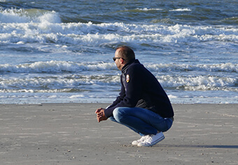 man thoughtful by sea