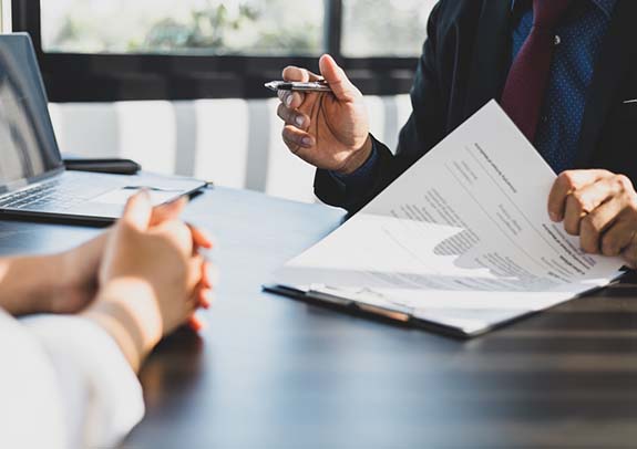 Image of people looking at documents.