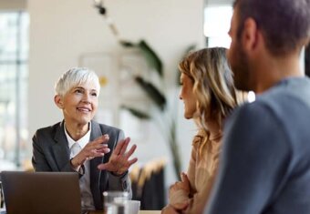 Image of legal advisor speaking to man and woman.